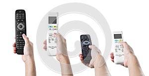 Hand holding air conditioner and television remote control on a white background