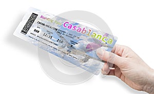 Hand holding an airline boarding pass ticket to Casablanca Morocco - Africa - all the contents of the concept image are totally