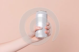 Hand holding aluminum can, mock up style. AI Generated