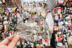 Hand holding aluminum can