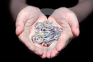 Hand holding aluminum cap