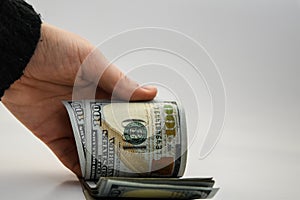 Hand holding American Cash, Dollars in hand on a white background