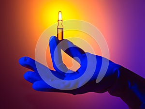 Hand Holding Ampule