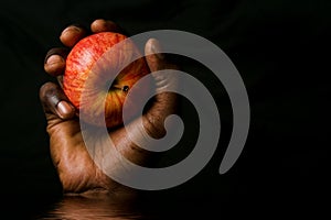 Hand holding apple