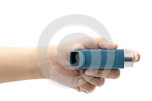 Hand holding asthma inhaler equipment