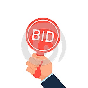 Hand holding auction paddle.