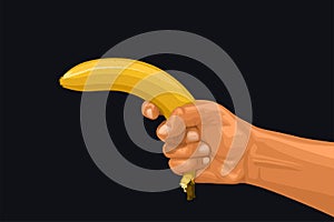 Hand holding banana as a gun