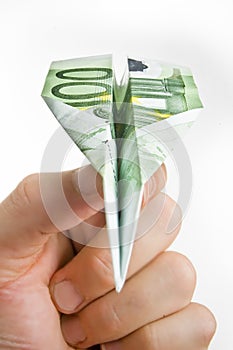 Hand Holding Banknote Paper Plane