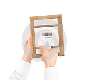 Hand holding bar code scanner and package bag isolated.