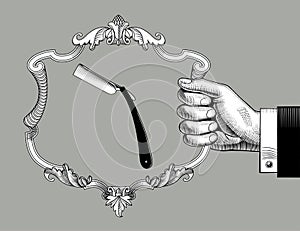 Hand holding a baroque decorative frame with a straight razor
