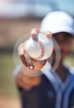 Hand holding baseball, closeup and man for sport, field and training with blurred background in sunshine. Softball