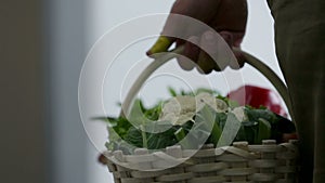 Hand holding a basket