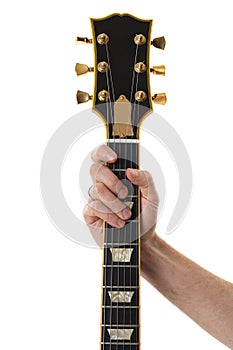 Hand holding a bass guitar neck