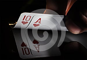 hand holding best classic winning blackjack combination ten and ace