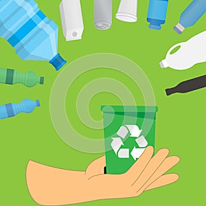 Hand holding a bin with recycle symbol on it and containers made from various materials