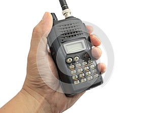 Hand holding black ham radio