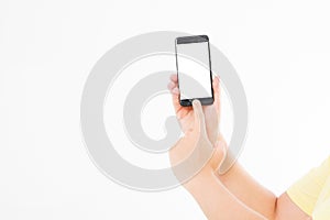 Hand holding black phone isolated on white clipping path inside. Top view.Mock up.Copy space.Template.Blank.