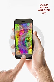 Hand holding Black Smartphone with color screen on white background