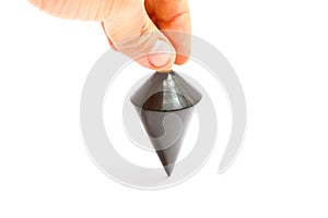 Hand holding a Black steel plummet cone shaped.