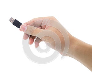 Hand holding black USB cable