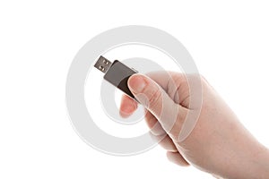 Hand holding black USB key