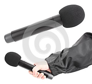 Hand is holding black wireless microphone