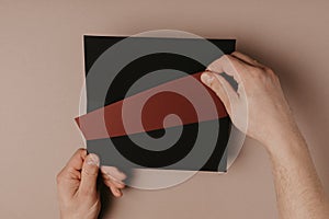 Hand holding blank envelope and letter mockup