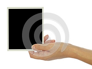 Hand holding blank photo frame