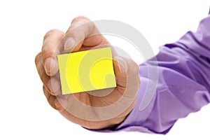 Hand holding blank post-it note