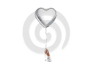 Hand holding blank silver heart balloon mockup, isolated