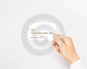 Hand holding blank white credit card mockup .