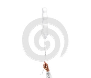 Hand holding blank white knobby balloon mockup, isolated photo