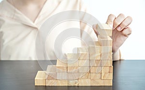 Hand holding blocks wood game, Concept Risk of management and strategy plan, growth business success process and team work