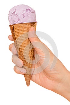 Hand holding blue berry ice cream cone isolated