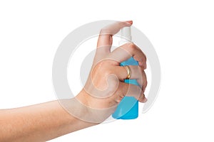 Hand holding blue color spay bottle