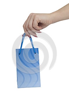 Hand holding blue gift bag