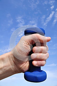 Hand Holding Blue Weight