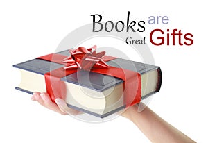 Hand holding a book for gift photo