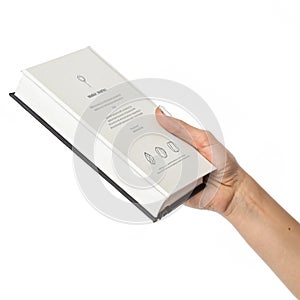 Hand holding a book with minimalist design photo
