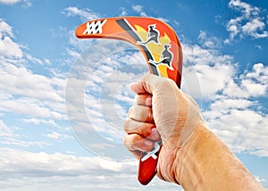 Hand holding a boomerang 1