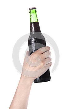 Hand holding Bottle of dark beer