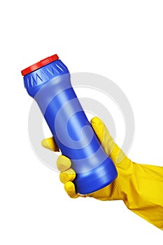 Hand holding bottle with detergent