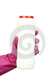Hand holding bottle with detergent