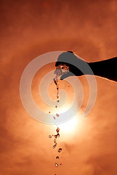 Hand holding a bottle of water