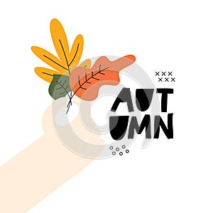 Hand holding bouquet of fall, autumn leaves. Design template for card, poster, flyer, banner and other use.