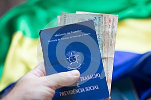 Hand holding brazilian work document and social security