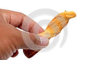 Hand holding bread stick isolated on white