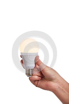 Hand holding bright led light bulb