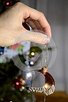 Hand holding a broken chritmas ball