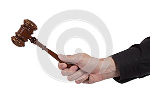 Hand holding a Brown gavel on a white background photo